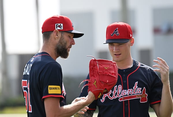 Atlanta Braves pitcher Chris Sale (left) talks with pitcher AJ Smith-Shawver during spring training workouts at CoolToday Park, Thursday, February 13, 2025, North Port, Florida. (Hyosub Shin / AJC)