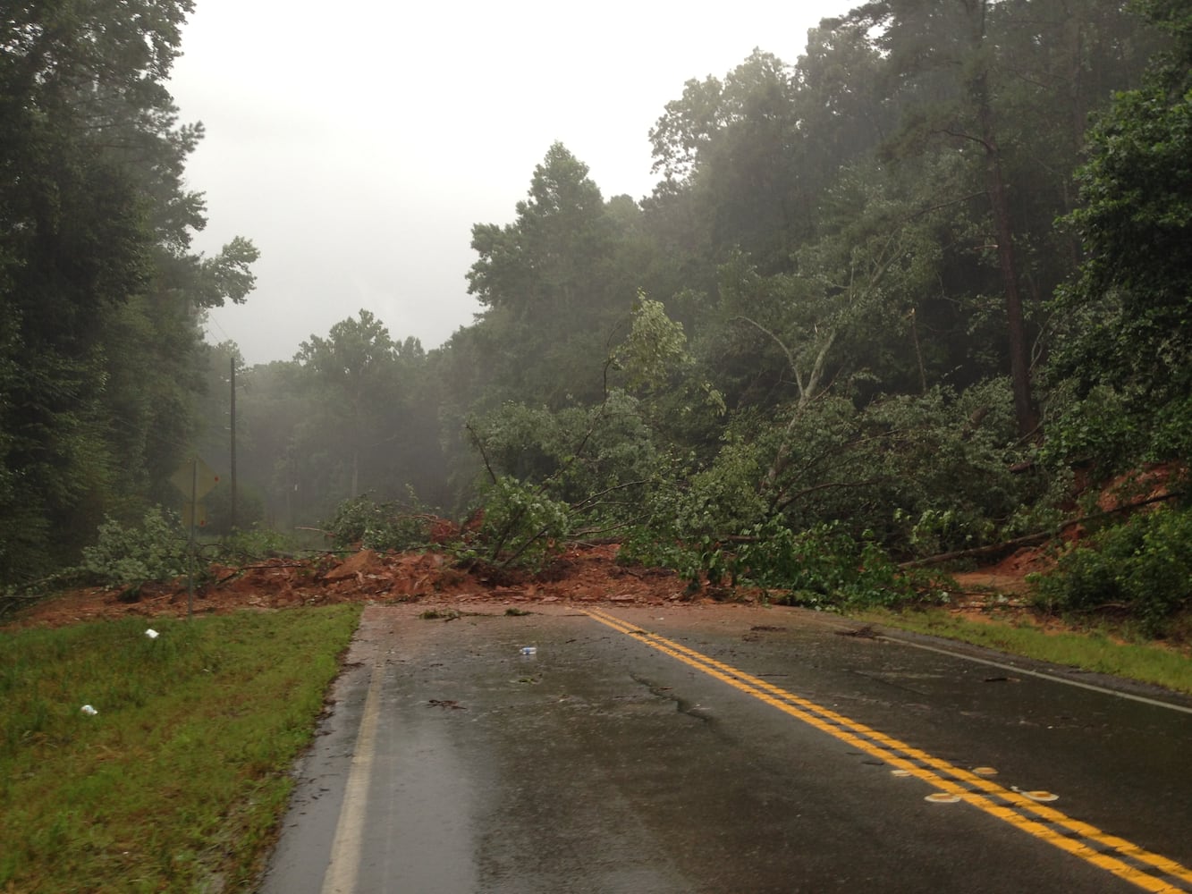 Atlanta Weather| Rain causes road damage, flooding in metro area