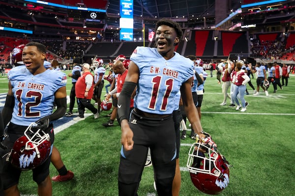 Carver-Columbus defensive end Tristian Givens (11) celebrates their win against Burke County in the GHSA Class 2A State Championship game at Mercedes-Benz Stadium, Tuesday, December 17, 2024, in Atlanta. Givens (four-star) is one of the top ranked junior prospects in the state for 2026. Carver-Columbus won 52-14. (Jason Getz / AJC)
