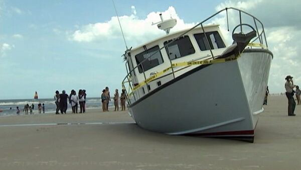 Jonathan Race said he doesn't know exactly how the boat ended up on the beach's shore. (Photo via WFTV.com)