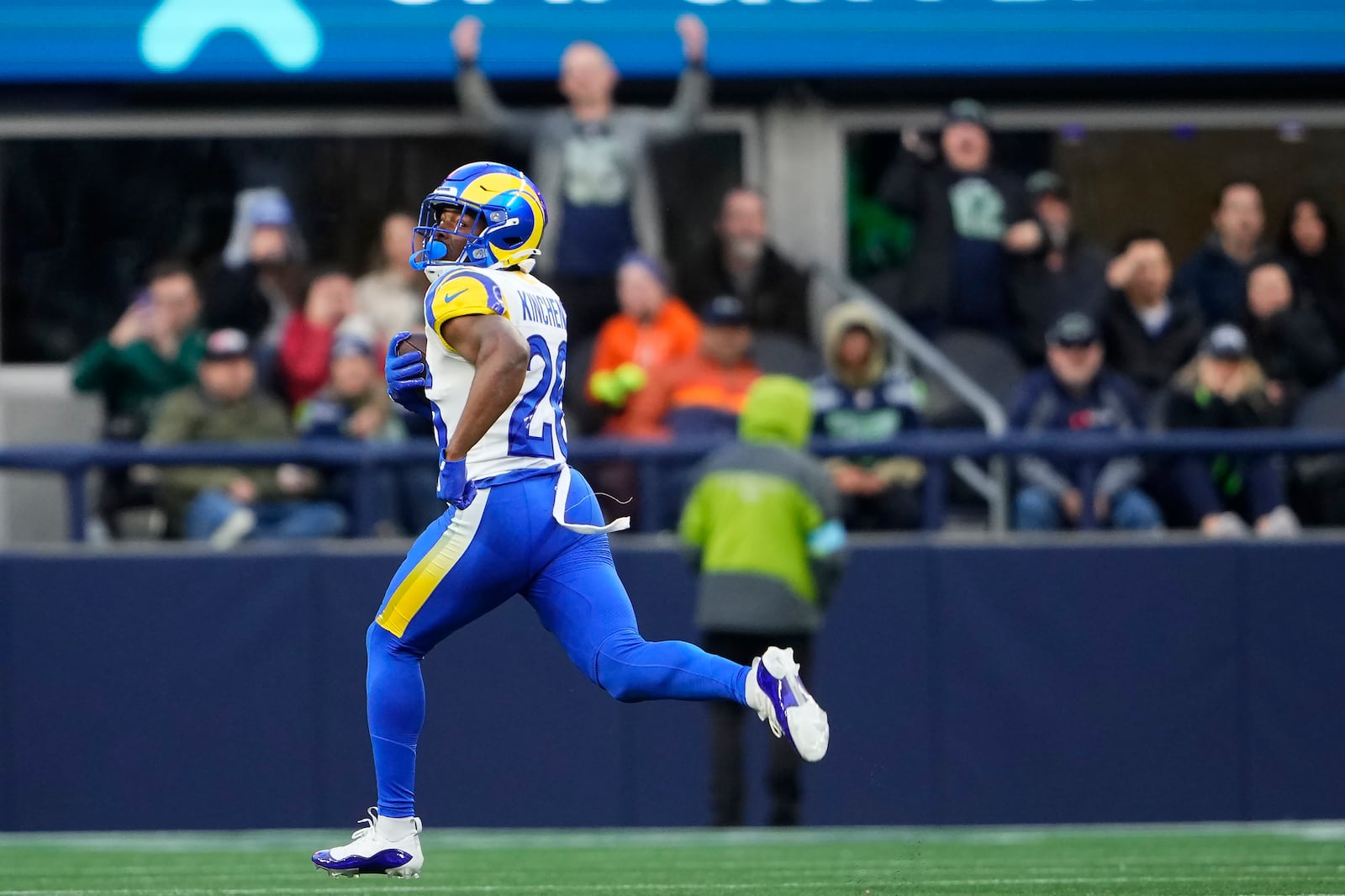 Los Angeles Rams safety Kamren Kinchens (26) returns an interception for a touchdown during the second half of an NFL football game against the Seattle Seahawks in Seattle, Sunday, Nov. 3, 2024. (AP Photo/Lindsey Wasson)