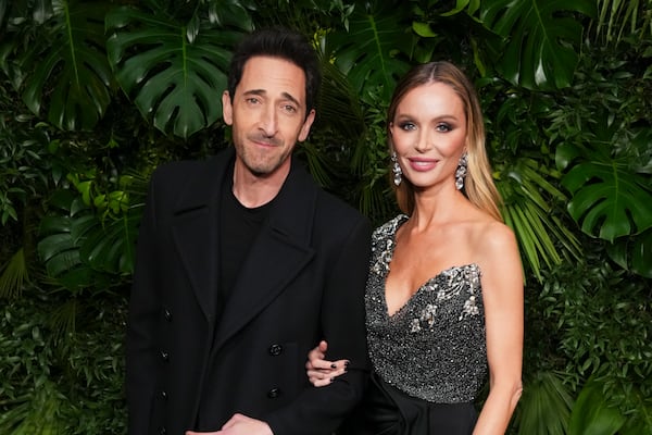 Adrien Brody, left, and Georgina Chapman arrive at Chanel's 16th Annual Pre-Oscar Awards Dinner on Saturday, March 1, 2025, at The Beverly Hills Hotel in Beverly Hills, Calif. (Photo by Jordan Strauss/Invision/AP)