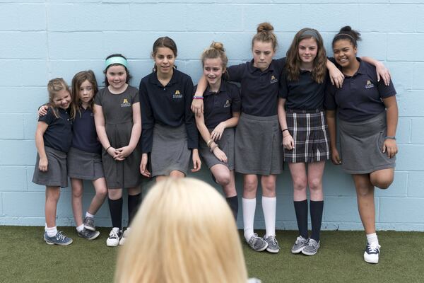 Kate T. Parker photographs girls who are featured in her new photo book, “Strong Is the New Pretty,” at Atlanta Academy. Parker began photographing her daughters six years ago. At the time, it was purely for herself. DAVID BARNES / SPECIAL