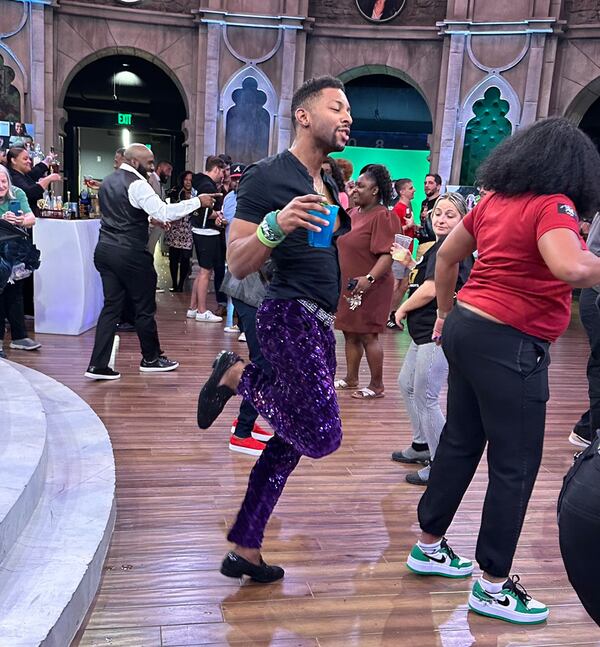 Atlanta podiatrist Josh Wilder, eliminated from "Survivor 44" on April 5, dances to the DJ beat at Ron Clark Academy for Clark's "Survivor" party April 12, 2023. RODNEY HO/rho@ajc.com