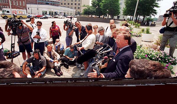 Richard Jewell’s attorney Jack Martin (right, wearing glasses, at microphone) during an afternoon press conference on August 20, 1996, in Atlanta. (credit: William Berry / AJC file)