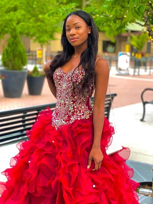 Kailen Bain models her prom dress which was donated to Enchanted Closet by RJR Props. The dress was part of a movie filmed in Atlanta. It had never been worn. Photo courtesy of Enchanted Closet