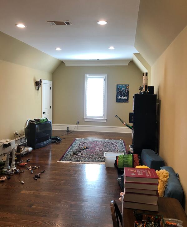 Before the overhaul, the mostly empty playroom can be seen begging for a facelift