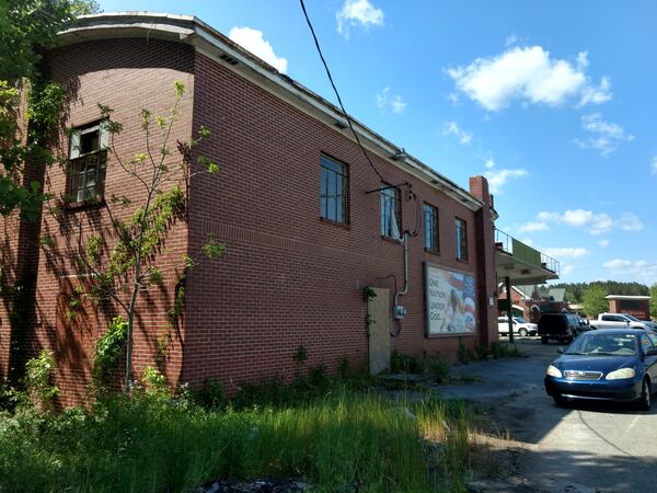 A photo taken earlier in 2018 shows the rear of the store building. A second floor once was used as a Masonic lodge, according to the Cherokee County Historical Society. (Brian O'Shea / bposhea@ajc.com)