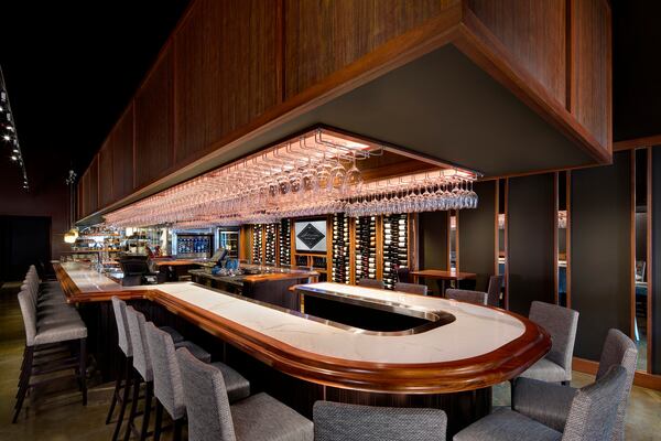 Stem Wine Bar in Marietta offers a classic wine bar experience with an inviting U-shaped bar. Photo: Stem Wine Bar.