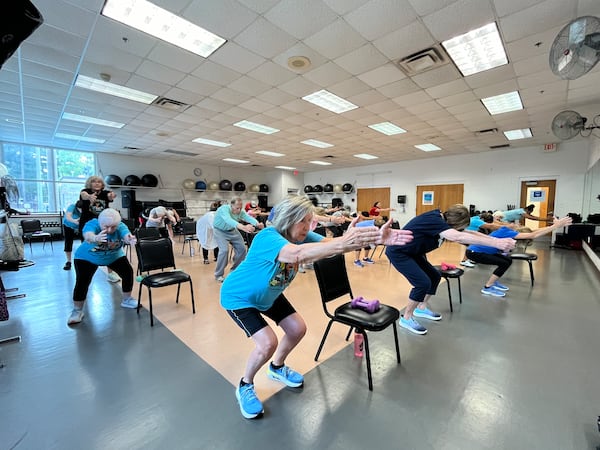 Senior participants work out during a local YMCA weights and exercise class. This type of physical activity can contribute to seniors’ ability to maintain independence over the long term. (Contributed by YMCA of Metro Atlanta)