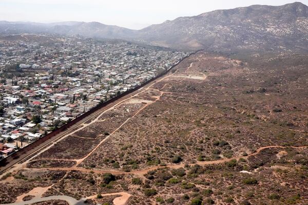 The U.S. Border with Mexico is seen in an aerial view Friday, Jan. 31, 2025, near San Diego. (AP Photo/Jae C. Hong)