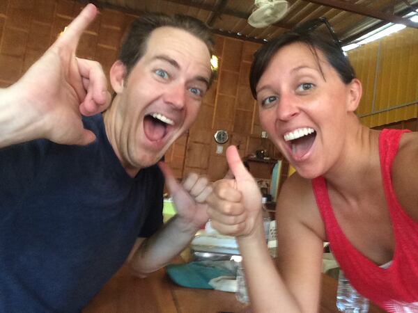 Nate and Jessica Baumgart celebrate the Chicago Cubs’ World Series win at a restaurant in Thailand. The couple lived in Chicago before embarking on a trip around the world. CONTRIBUTED