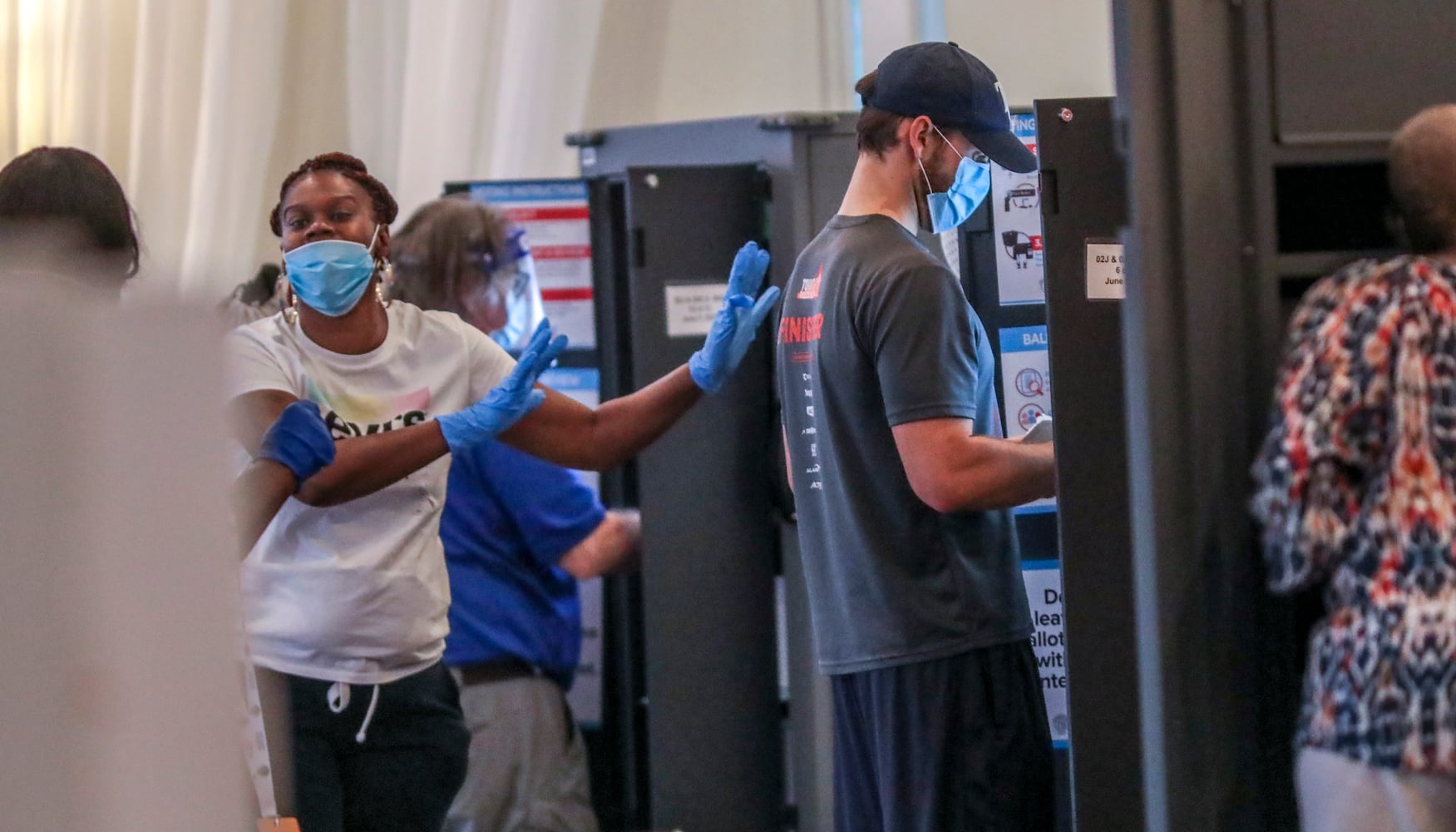 PHOTOS: Georgia voters struggle with long lines, new equipment, social distancing