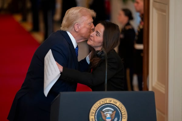 Allyson Phillips, mother of Laken Riley, and President Donald Trump embrace ahead of the signing of the Laken Riley Act in the East Room of the White House in Washington, D.C., on Wednesday, Jan. 29, 2025. (Nathan Posner for the AJC)