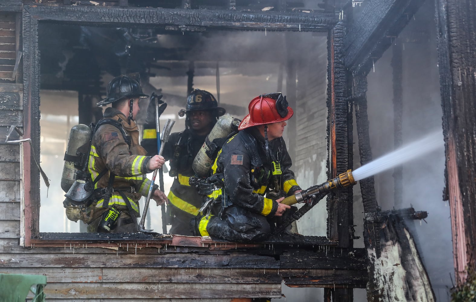 Amid arctic temperatures Wednesday morning, Jan. 17, 2024 a fire destroyed an abandoned house in northwest Atlanta, according to officials. Crews were dispatched around 8 a.m. to the vacant one-story home in the 600 block of Jett Street near Sunset Avenue, according to Atlanta fire Capt. Raymondo Hampton. Firefighters took a defensive attack on the fully involved residence until they could get to a point where they could conduct a search inside. No one was found during the search. “We were able to get a good stop on it pretty quick,” Hampton told The Atlanta Journal-Constitution. While the cause and origin of the fire is under investigation, Hampton said he suspects it was just people trying to stay warm. “It’s cold temperatures outside right now, we’re at about 14 degrees,” he said. The low temps were an obstacle for firefighters, who Hampton said typically bring extra equipment and clothes during similar operations as a precaution. He noted it was the second time fire crews responded to the home in recent months. No injuries were reported Wednesday. (John Spink / John.Spink@ajc.com)