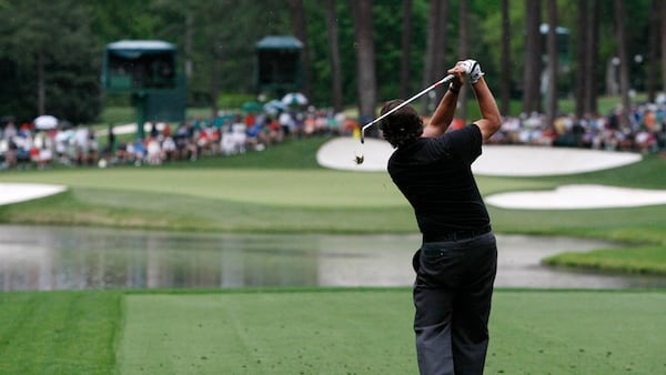 Phil Mickelson tees off on the par-3 16th hole Thursday, April 5, 2012, at Augusta National Golf Club in Augusta.