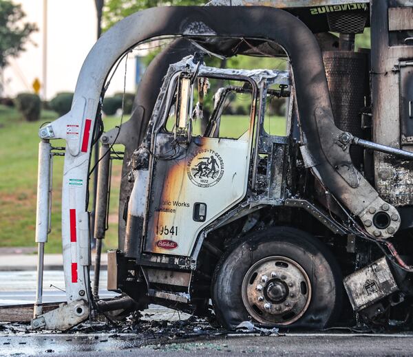 The driver sustained minor injuries when he tried to extinguish the natural gas fire with a fire extinguisher and fell back on his elbow, according to DeKalb County fire officials. 