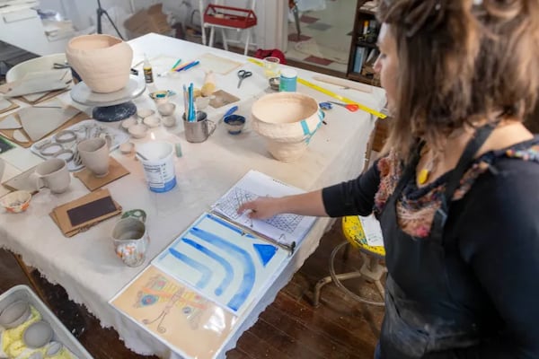 Artist K. Tauches inside her studio. (Photo Courtesy of Isadora Pennington)