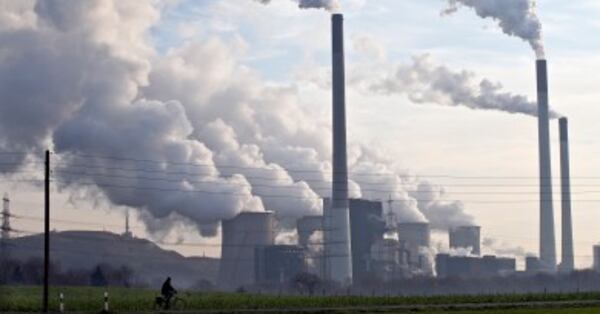 Steam and smoke is seen over the coal burning power plant in Gelsenkirchen, Germany, on Wednesday, Dec. 16, 2009. Coal power plants are among the biggest producer of CO2, that is supposed to be responsible for climate change. Delegates from 193 nations at a U.N. climate talks conference in Copenhagen are deadlocked in talks on a deal to curb global warming.(AP Photo/Martin Meissner)