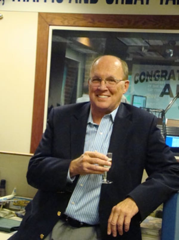 Neal Boortz takes in some champagne during a break after announcing his pending retirement in January 2013. CREDIT: Rodney Ho/rho@ajc.com