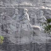 This June 23, 2015, file photo shows a carving depicting confederates Stonewall Jackson, Robert E. Lee and Jefferson Davis, in Stone Mountain, Georgia. (AP Photo/John Bazemore, File)