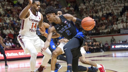 Virginia Tech's P.J. Horne (left) defends against Duke forward Cam Reddish (2) on Feb. 26, 2019. (AP Photo/Lee Luther Jr.)