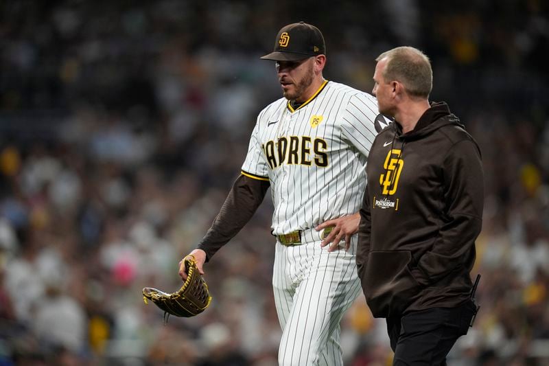 San Diego Padres starting pitcher Joe Musgrove exits the game during the fourth inning in Game 2 of an NL Wild Card Series baseball game against the Atlanta Braves, Wednesday, Oct. 2, 2024, in San Diego. (AP Photo/Gregory Bull)