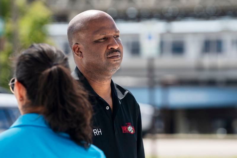 Forest Park Mayor Rory Hoskins stands outside the Forest Park Blue Line train station in Forest Park, Ill., which remains closed, after giving a news conference about four people who were fatally shot on the train early Monday, Sept. 2, 2024. (Pat Nabong/Chicago Sun-Times via AP)