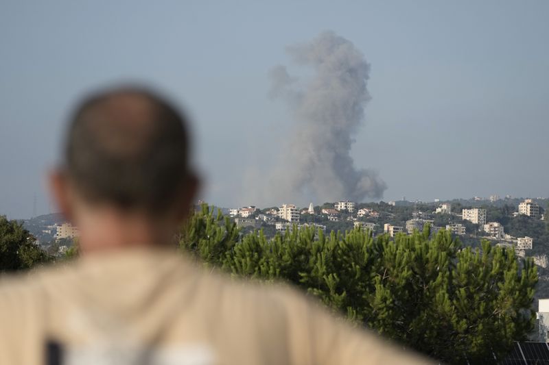 Smoke rises from an Israeli airstrike north of Beirut, in the village of Ras Osta, Byblos district, seen from Maaysrah, Lebanon, Wednesday, Sept. 25, 2024. (AP Photo/Bilal Hussein)