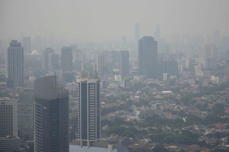 FILE- Haze blankets the main business district in Jakarta, Indonesia, on Aug. 11, 2023. (AP Photo/Dita Alangkara, File)