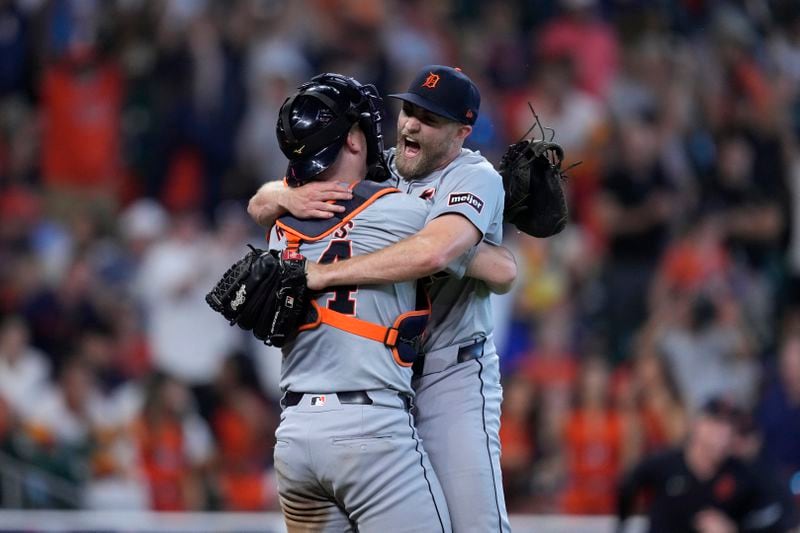 Detroit Tigers catcher Jake Rogers, left, and relief pitcher Will Vest, right, celebrate the team's 5-2 win against the Houston Astros in Game 2 of an AL Wild Card Series baseball game Wednesday, Oct. 2, 2024, in Houston. (AP Photo/Kevin M. Cox)