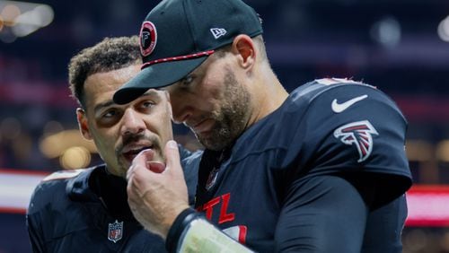 Atlanta Falcons quarterback Kirk Cousins (18) walks with Atlanta Falcons safety Justin Simmons (31) after their team lost 22-17 against the Kansas City Chiefs on Sunday, Sept. 22, 2024, at Mercedes-Benz Stadium in Atlanta. 
(Miguel Martinez/ AJC)