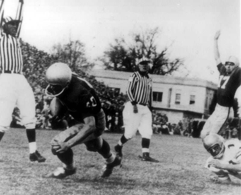 Georgia running back Theron Sapp scores the game-winning touchdown against Georgia Tech on Nov. 30, 1957 at Grant Field in Atlanta. Georgia won 7-0 and ended a seven-game losing streak against the Yellow Jackets. (AJC file photo)