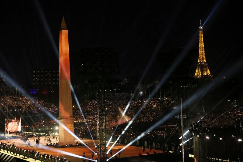 The Obelisk of La Concorde plaza and the Eiffel Tower get lightenings during the Opening Ceremony for the 2024 Paralympics, Wednesday, Aug. 28, 2024, on La Concorde plaza in Paris, France. (AP Photo/Thomas Padilla)