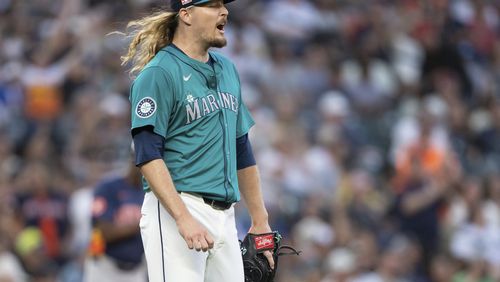 Seattle Mariners relief pitcher Ryne Stanek reacts after giving up a two-run home run during the seventh inning of a baseball game against the Houston Astros, Saturday, July 20, 2024, in Seattle. (AP Photo/Stephen Brashear)