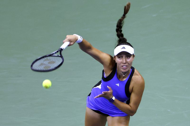 FILE - Jessica Pegula, of the United States, serves to Iga Świątek, of Poland, during the quarterfinals of the U.S. Open tennis championships, Sept. 4, 2024, in New York. (AP Photo/Adam Hunger, File)