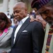 Faith leaders and other supporters pray over New York City Mayor Eric Adams, center, during a rally and prayer vigil on the steps of City Hall in New York, Tuesday, Oct. 1, 2024. (AP Photo/Seth Wenig)