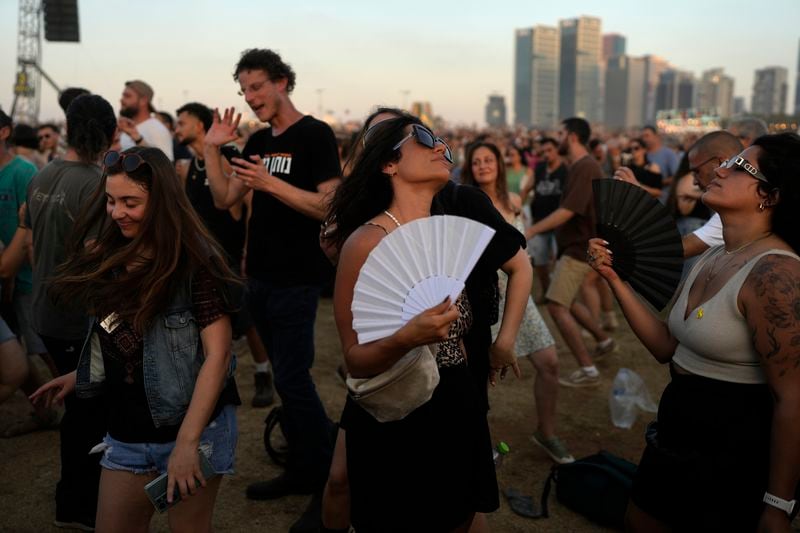 People dance the Nova Healing Concert in Tel Aviv, Israel, on Thursday, June 27, 2024. This was the first Tribe of Nova mass gathering since the Oct. 7, 2023 cross-border attack by Hamas that left hundreds at the Nova music festival dead or kidnapped to Gaza. (AP Photo/Ohad Zwigenberg)