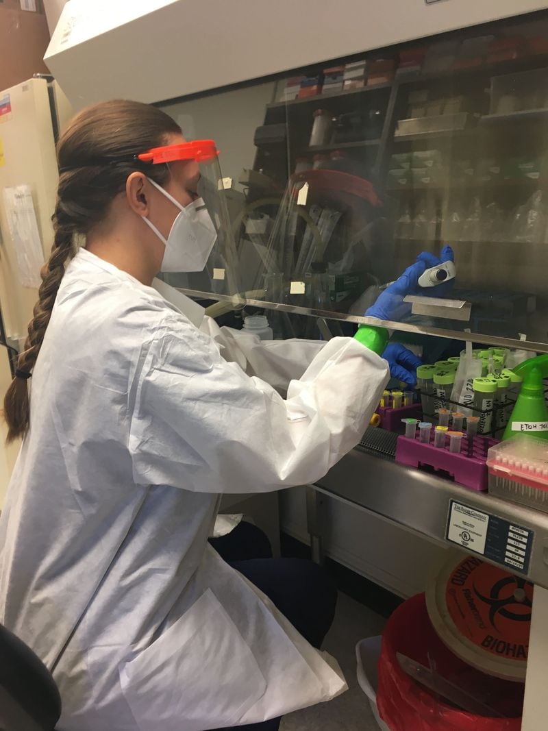 Taylor Maddalene, an academic professional in the UGA School of Engineering prepares wastewater samples for analysis.