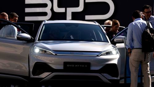 FILE - Visitors check the China made BYD ATTO 3 at the IAA motor show in Munich, Germany, on Sept. 8, 2023. (AP Photo/Matthias Schrader, File)