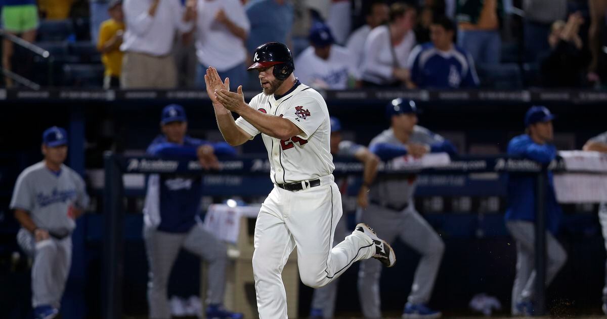 Let's all watch Evan Gattis homer on a pitch he had no business