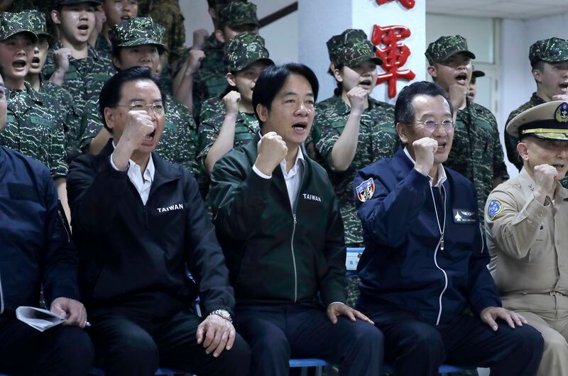 Taiwan President Lai Ching-te, center, poses for a photo during his visit to inspect Taiwanese military in Taoyuan, Northern Taiwan, Thursday, May 23, 2024. (AP Photo/Chiang Ying-ying)
