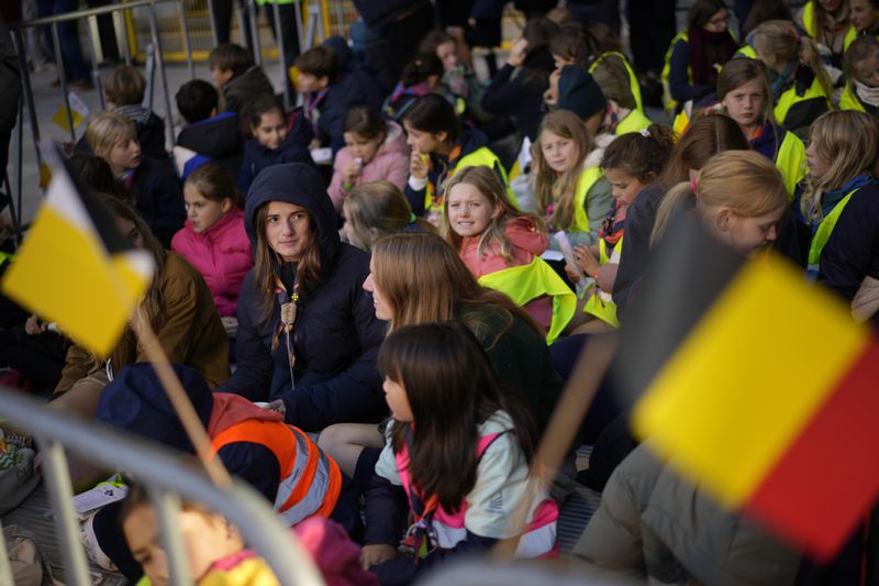 Faithful wait for the start of a mass presided by Pope Francis at King Baudouin Stadium, in Brussels Sunday, Sept. 29, 2024. (AP Photo/Andrew Medichini)