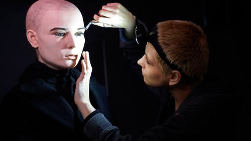 In this undated handout photo provided by The National Wax Museum Plus, Artistic Coordinator Mel Creek applies the finishing touches on a wax figure of the late singer Sinead O'Connor, at the National Wax Museum Plus on Dublin's Westmorland Street, Ireland. A wax figure of Sinéad O’Connor that did not compare to how the late singer looked caused a minor meltdown among fans and family members, leading a Dublin museum on Friday, July 26, 2024, to pull it from its collection. The National Wax Museum Plus apologized to O'Connor's family and said it would aim to create a more accurate representation of the singer of “Nothing Compares 2 U.” (Julien Behal via AP)