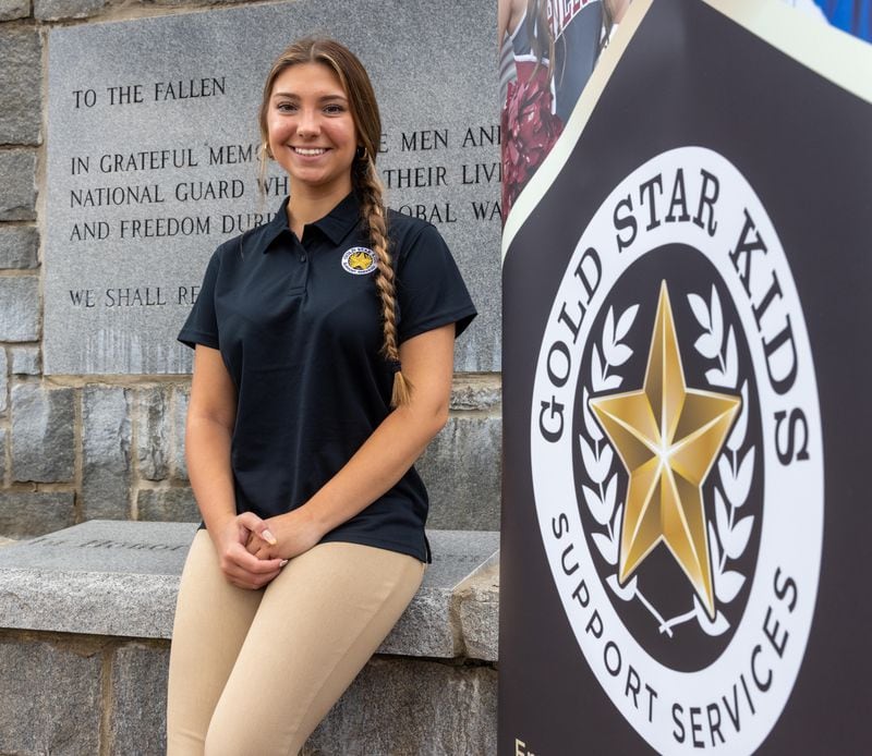 Portrait of Leighanne Bryant at the Memorial Wall at Clay National Guard Base in Marietta. She created a non-profit, Gold Star Kids Support Services, to help children of Gold Star families be able to enjoy youth activities. Gold Star is the designation given to military children, families & spouses who lost a spouse or parent in active-duty military service.
 PHIL SKINNER FOR THE ATLANTA JOURNAL-CONSTITUTION