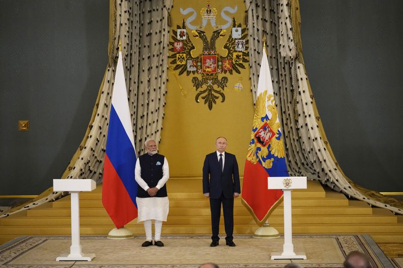Indian Prime Minister Narendra Modi, left, and Russian President Vladimir Putin stand in a hall in the Kremlin in Moscow, Russia, Tuesday, July 9, 2024. (AP Photo/Alexander Zemlianichenko)