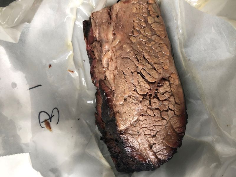 A pound of brisket from DAS BBQ was wrapped in butcher paper that was noticeably oily, but, then again, it hadn’t dried out. CONTRIBUTED BY WENDELL BROCK