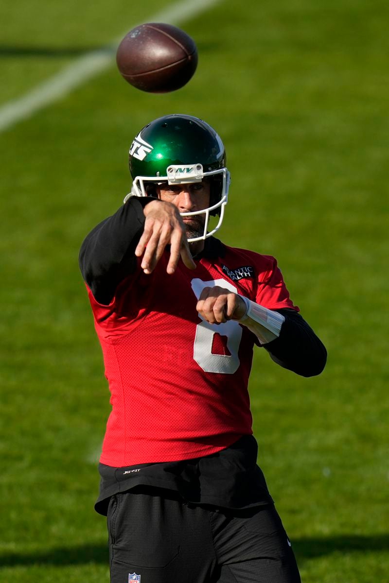 New York Jets quarterback Aaron Rodgers (8) participates in a training session in Ware, England, Friday, Oct. 4, 2024, ahead of the game between New York Jets and Minnesota Vikings at the Tottenham Hotspur stadium on Sunday. (AP Photo/Alastair Grant)