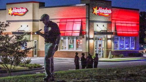 Fairburn police were investigating a shooting in the parking lot of the Hardee’s on Senoia Road on Friday, Sept. 18, 2015. JOHN SPINK / JSPINK@AJC.COM