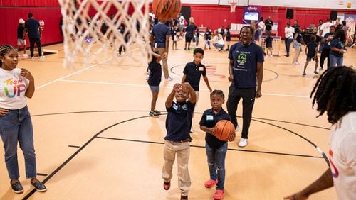 Students from the Boyce Ansley School downtown had their first field trip to Marietta where a day of sporting activities ended with each child receiving a laptop. Courtesy of Tim Harman